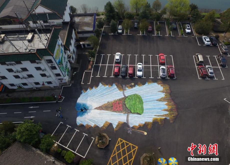 Giant 3D waterfall painted on parking lot in C China