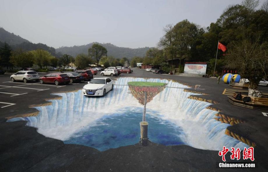 Giant 3D waterfall painted on parking lot in C China