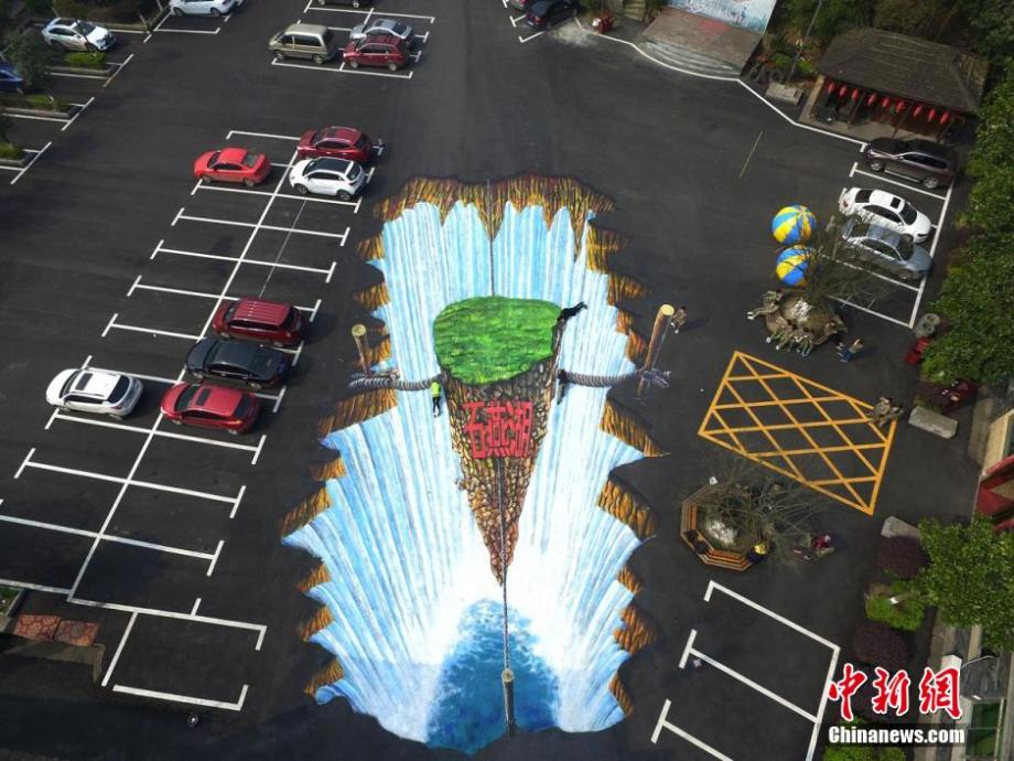Giant 3D waterfall painted on parking lot in C China
