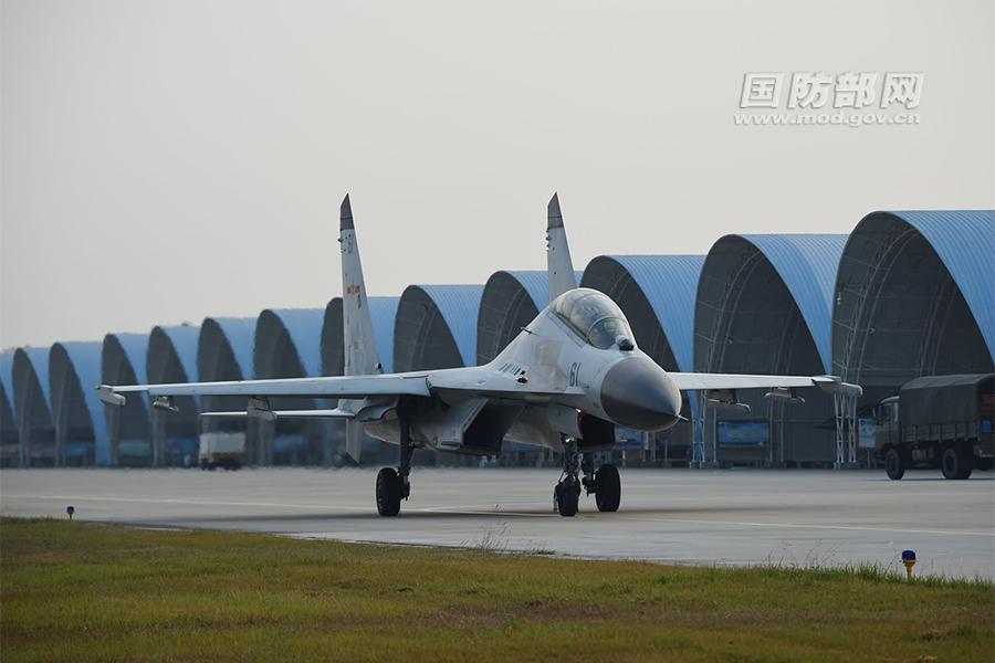 Chinese J-11 fighters conduct training in South China Sea