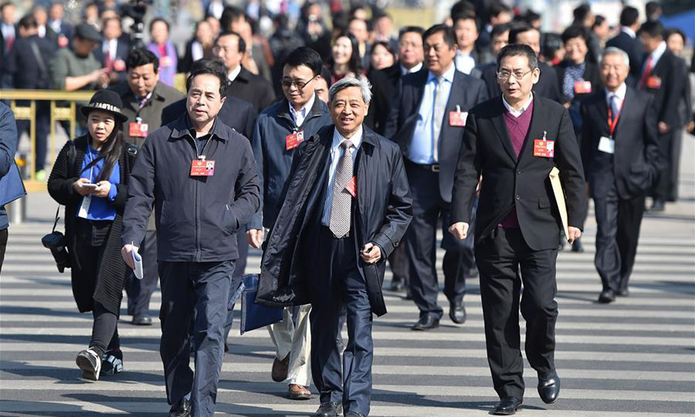 Members of 12th National Committee of CPPCC arrive for closing meeting of annual session