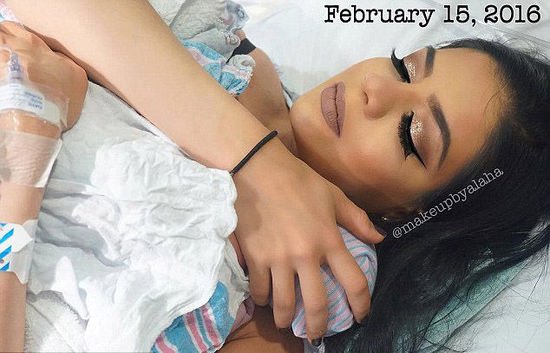American woman puts on full face make-up in the middle of giving birth