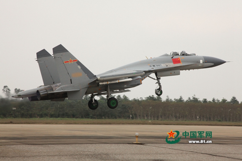 J-11 fighter jets conduct air-to-air combat training