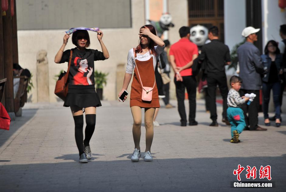Stylish women in summer dress in street of Fuzhou