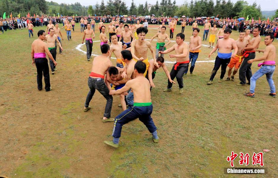 Half-naked men scramble for fireworks in Guangxi