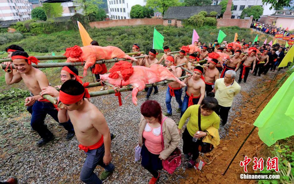 Half-naked men scramble for fireworks in Guangxi