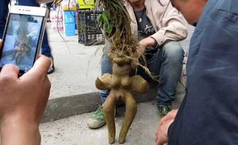Man peddles human-shaped root in street