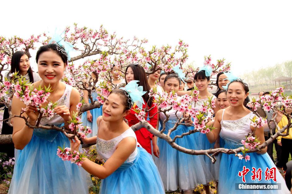 Intoxicating view: Sea of peach flowers and flower fairies