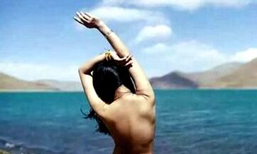 Chinese woman poses nude at sacred Tibetan lake