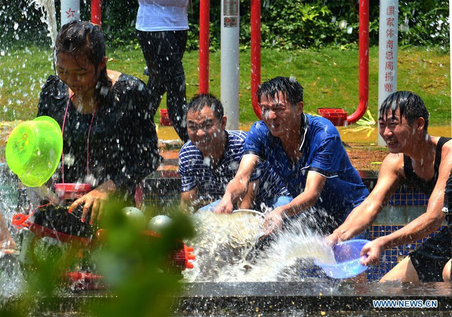 Water-sprinkling festival celebrated in SW China's Yunnan