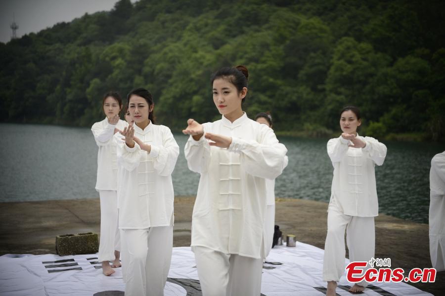 Tai Chi master leads lake performance 