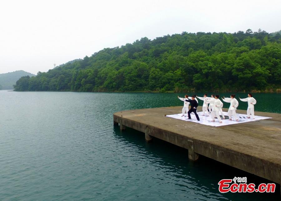Tai Chi master leads lake performance 