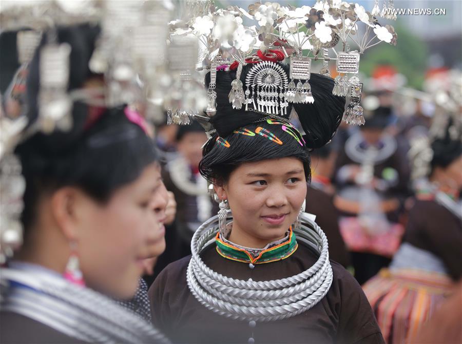 Traditional costumes of Miao ethnic group displayed on parade show in SW China
