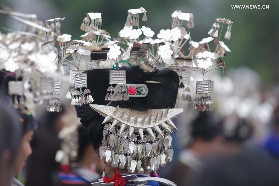 Traditional costumes of Miao ethnic group displayed on parade show in SW China