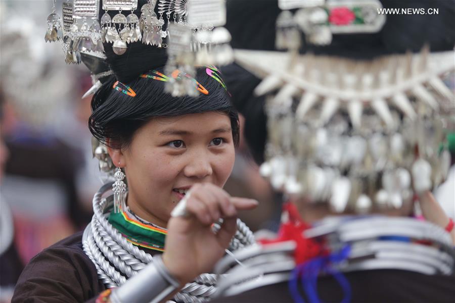Traditional costumes of Miao ethnic group displayed on parade show in SW China