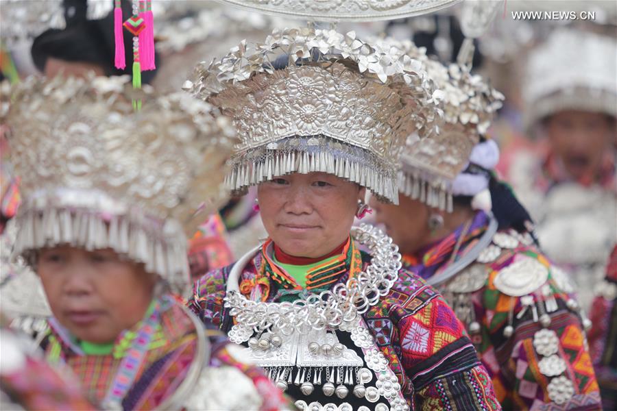 Traditional costumes of Miao ethnic group displayed on parade show in SW China