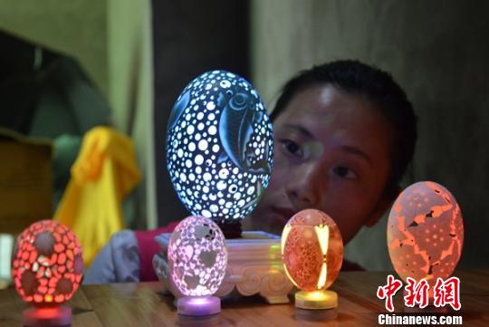 ‘World on an eggshell’: disabled girl develops passion for egg carving