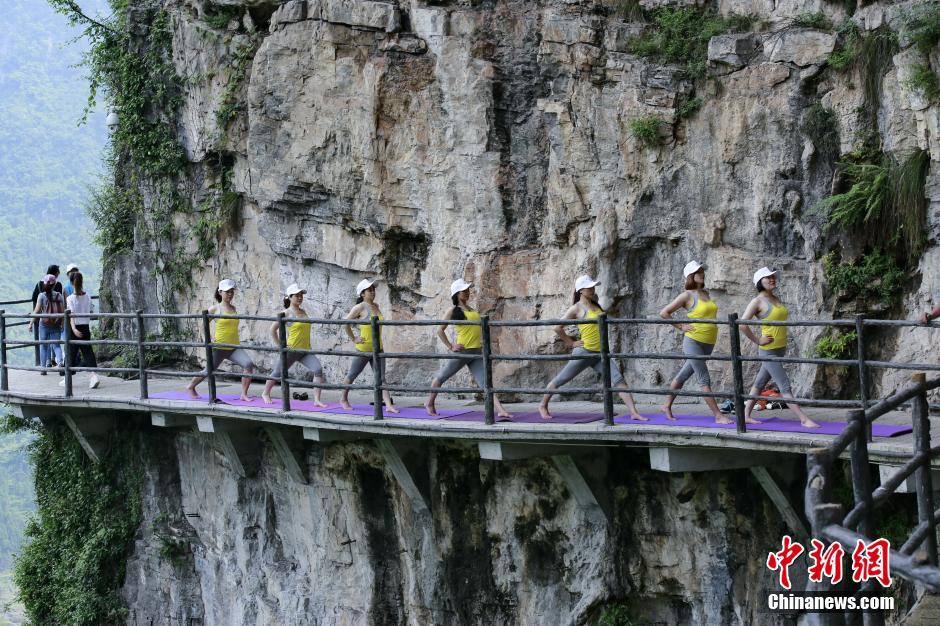 Yoga performance on cliff road in C China