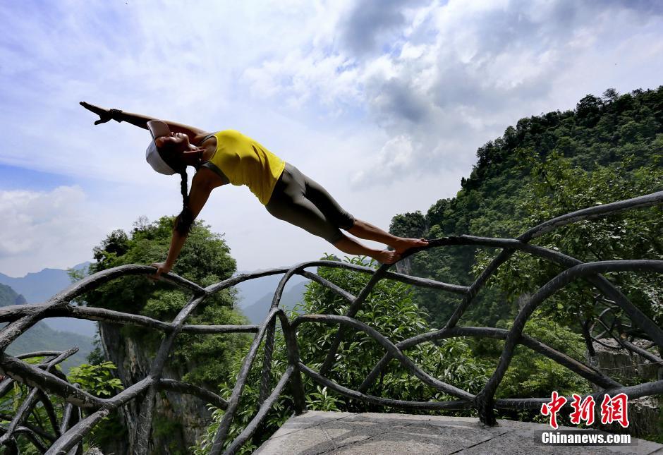 Yoga performance on cliff road in C China