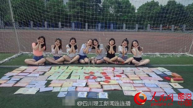 Eight college girls take graduation photos with over 100 certificates