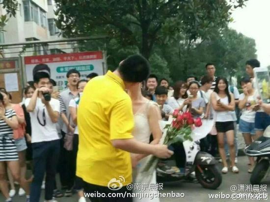 Female college teacher proposes to student in wedding dress