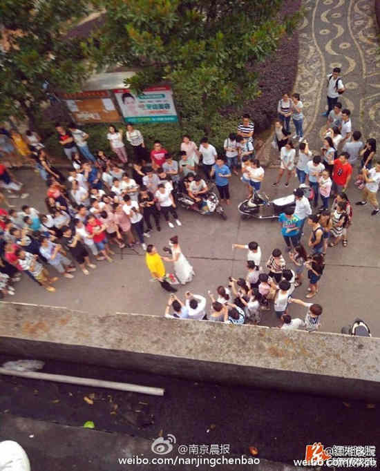 Female college teacher proposes to student in wedding dress