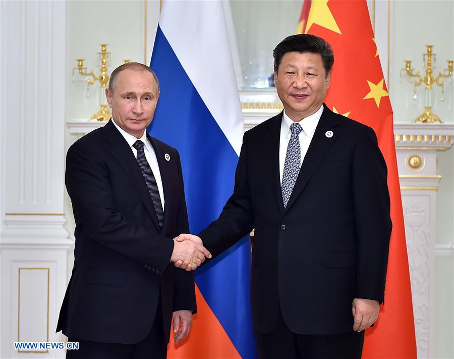 Xi, Putin meet on promoting SCO's regional role