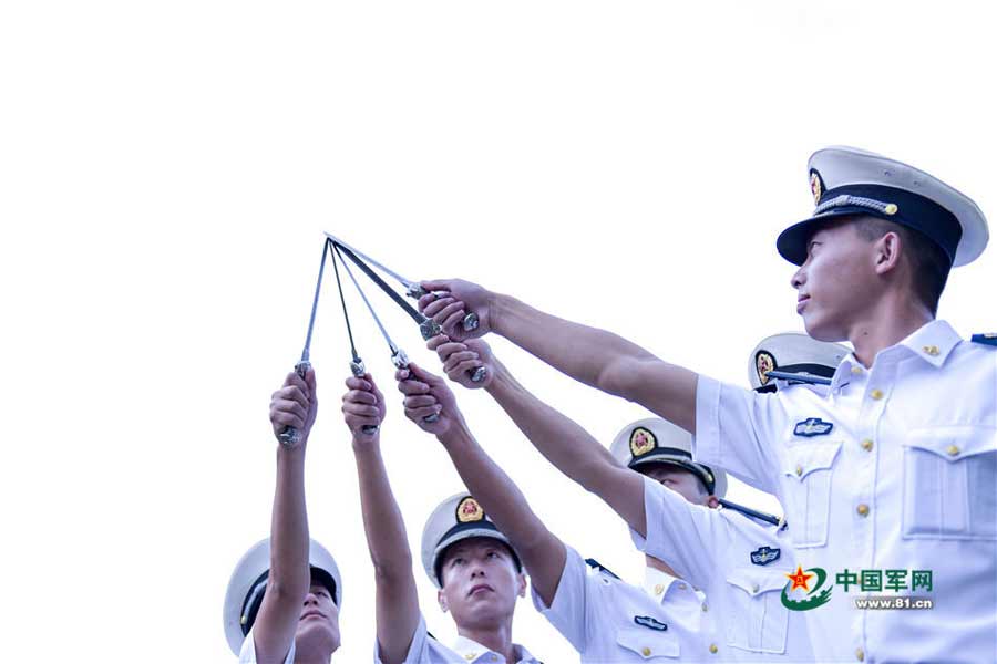 Swords conferred upon naval academy graduates