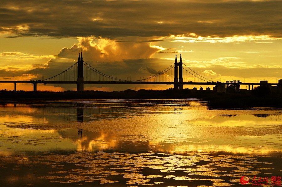 Fiery sunset glows over Songhua River