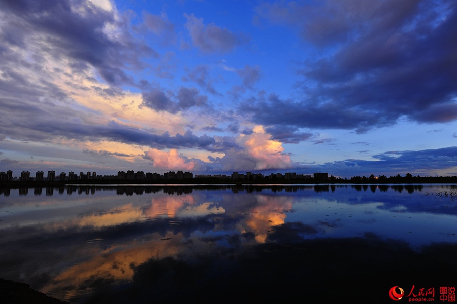 Fiery sunset glows over Songhua River