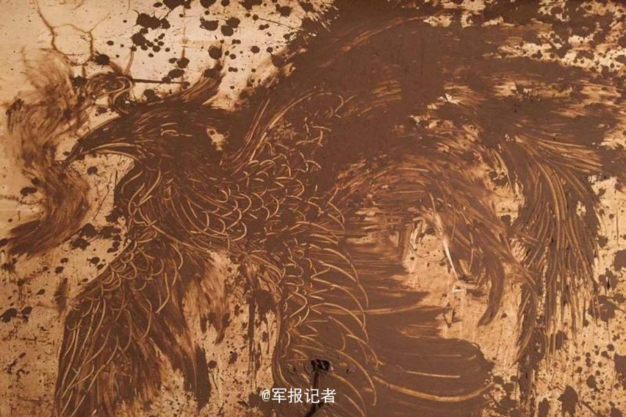 Rising from the ashes: soldier creates beautiful mural from Nepartak mud
