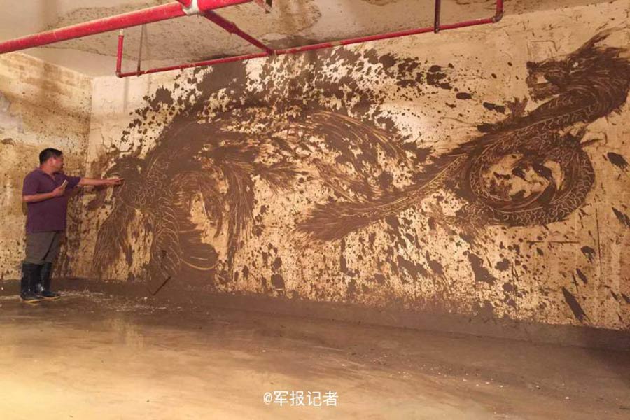 Rising from the ashes: soldier creates beautiful mural from Nepartak mud
