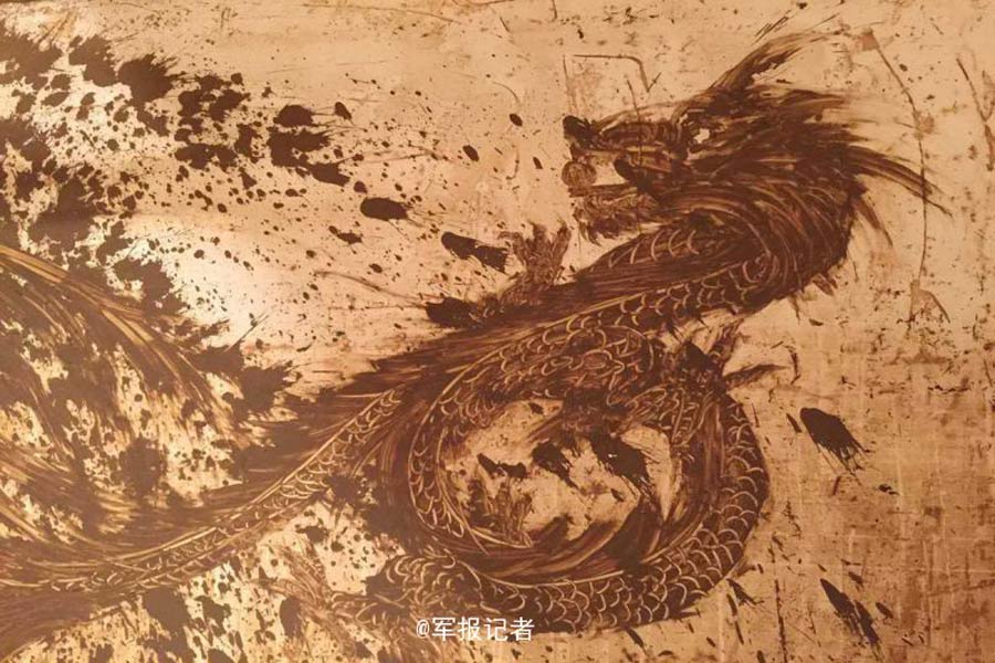 Rising from the ashes: soldier creates beautiful mural from Nepartak mud