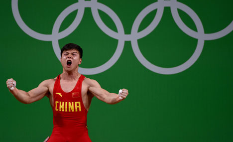 Weightlifter smashes world record to win Olympic gold