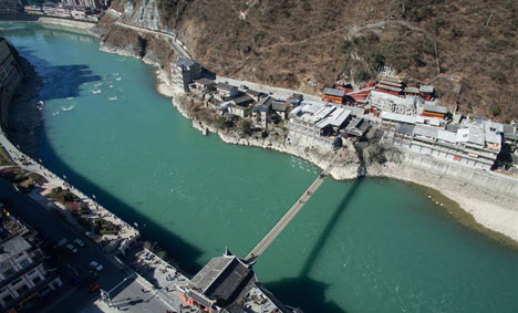 Tourists walk on Luding Bridge in SW China's Sichuan