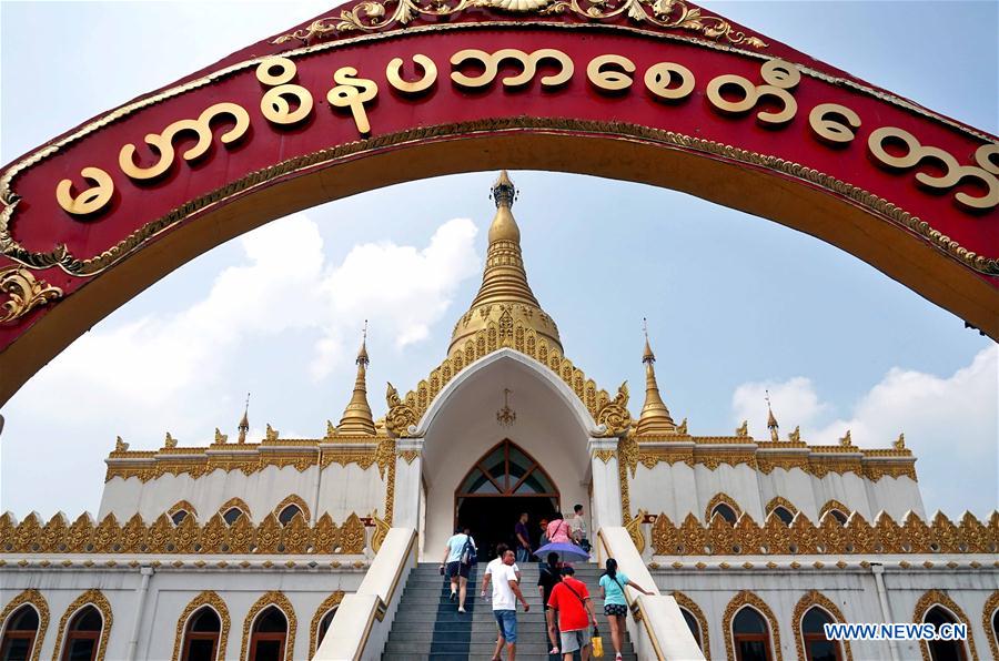 People visit Myanmar style shrine in C China's Henan