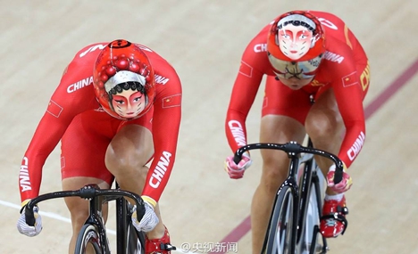 Olympic cyclists wear Peking Opera mask