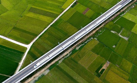In pics: High-speed train driving past fields