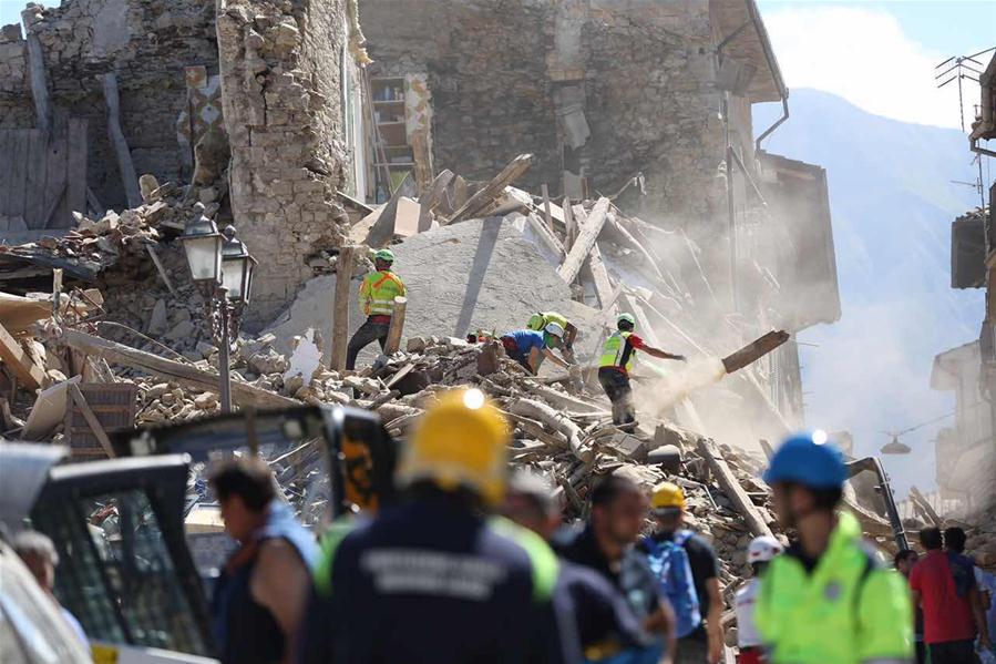 Spotlight: Rescuers in race against time as over 100 killed in quake in central Italy