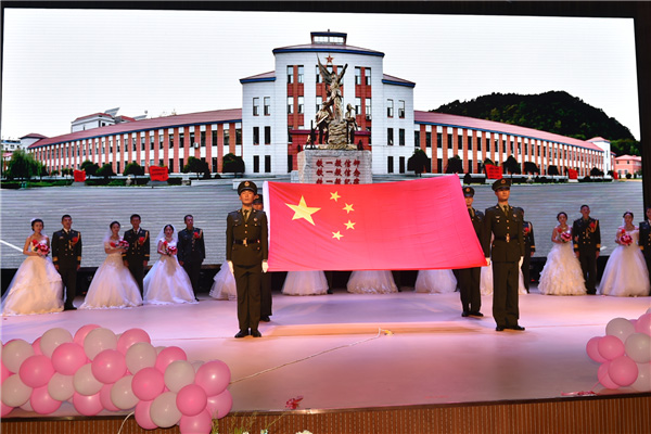 Couples exchanges 'bullet shell rings' at group wedding in military camp