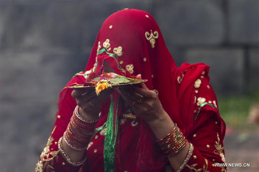 Women offer prayers during Teej festival in Kathmandu