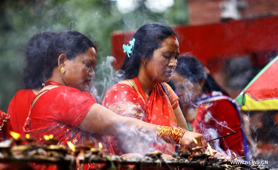 Women offer prayers during Teej festival in Kathmandu