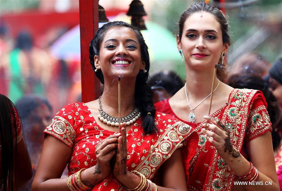 Women offer prayers during Teej festival in Kathmandu