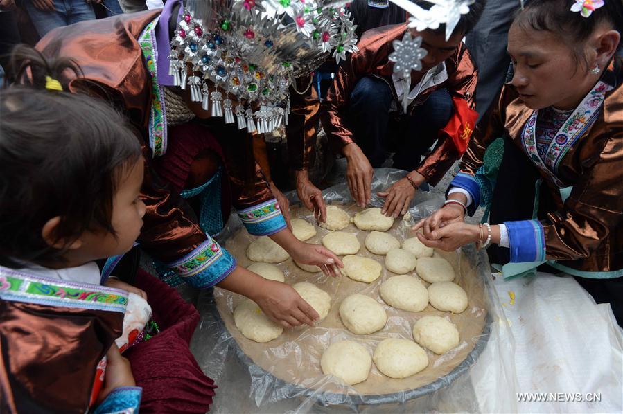 The festival, during which local people make sticky rice cakes, is held on Monday to celebrate the harvest and to pray for a good farming season.