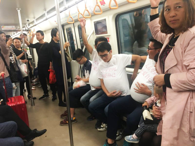 'Pregnant' men in Chengdu subway call for more freedom for pregnant women