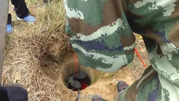 Firefighter squeezes into narrow well to rescue trapped boy 