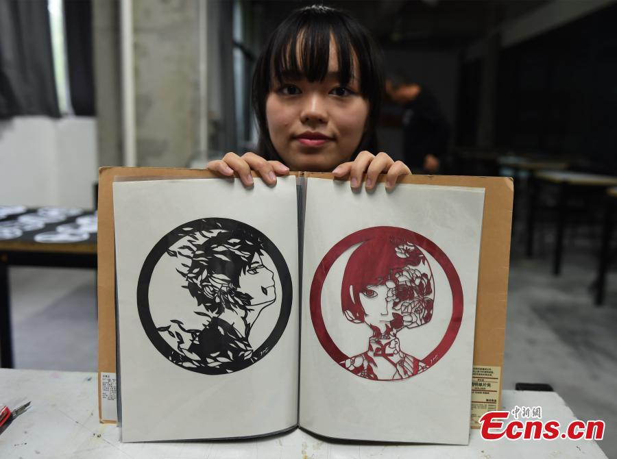 Paper silhouette works honor China's Olympic idols