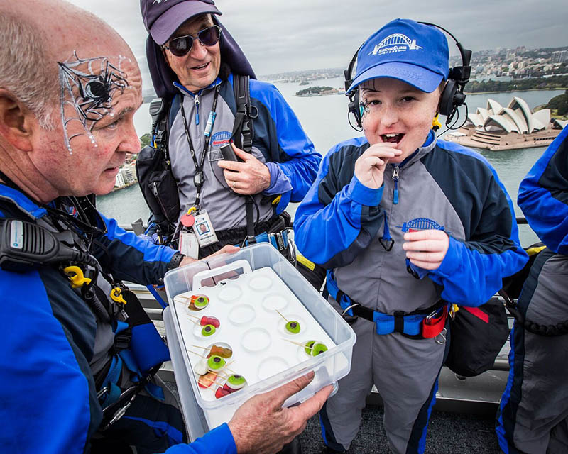 Kids from charity group dance the Monster Mash on the Sydney Harbour Bridge for Halloween
