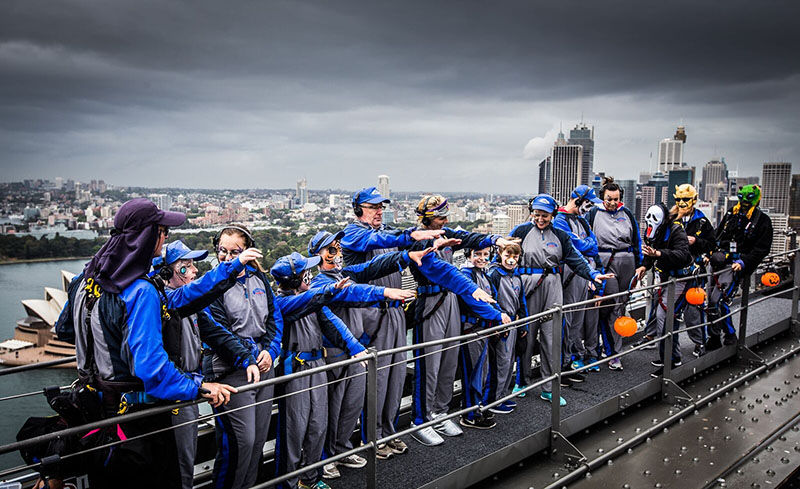 Kids from charity group dance the Monster Mash on the Sydney Harbour Bridge for Halloween