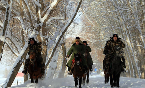 Border police patrol in snowy Xinjiang